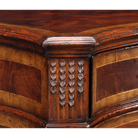 Detailed carving on corner of mahogany sideboard.