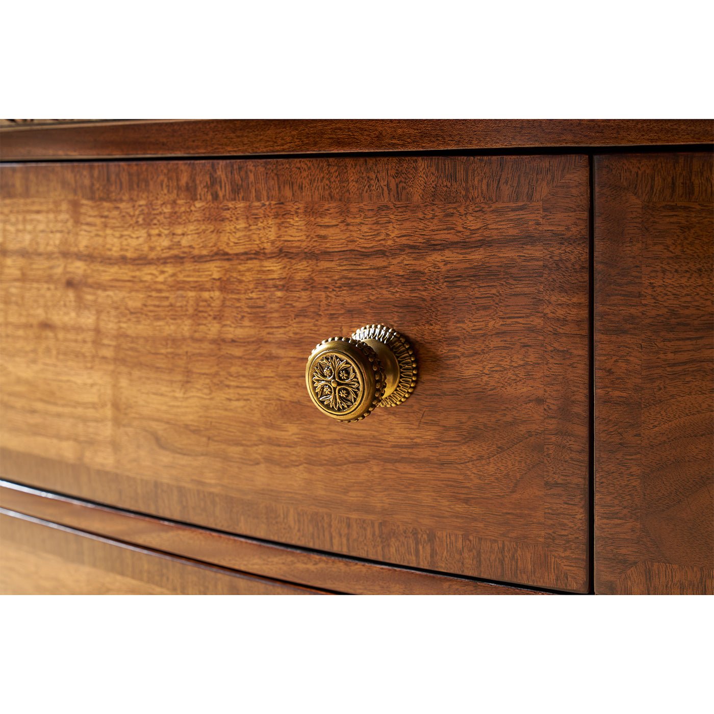 Close-up of drawer knob on English six drawer dresser.