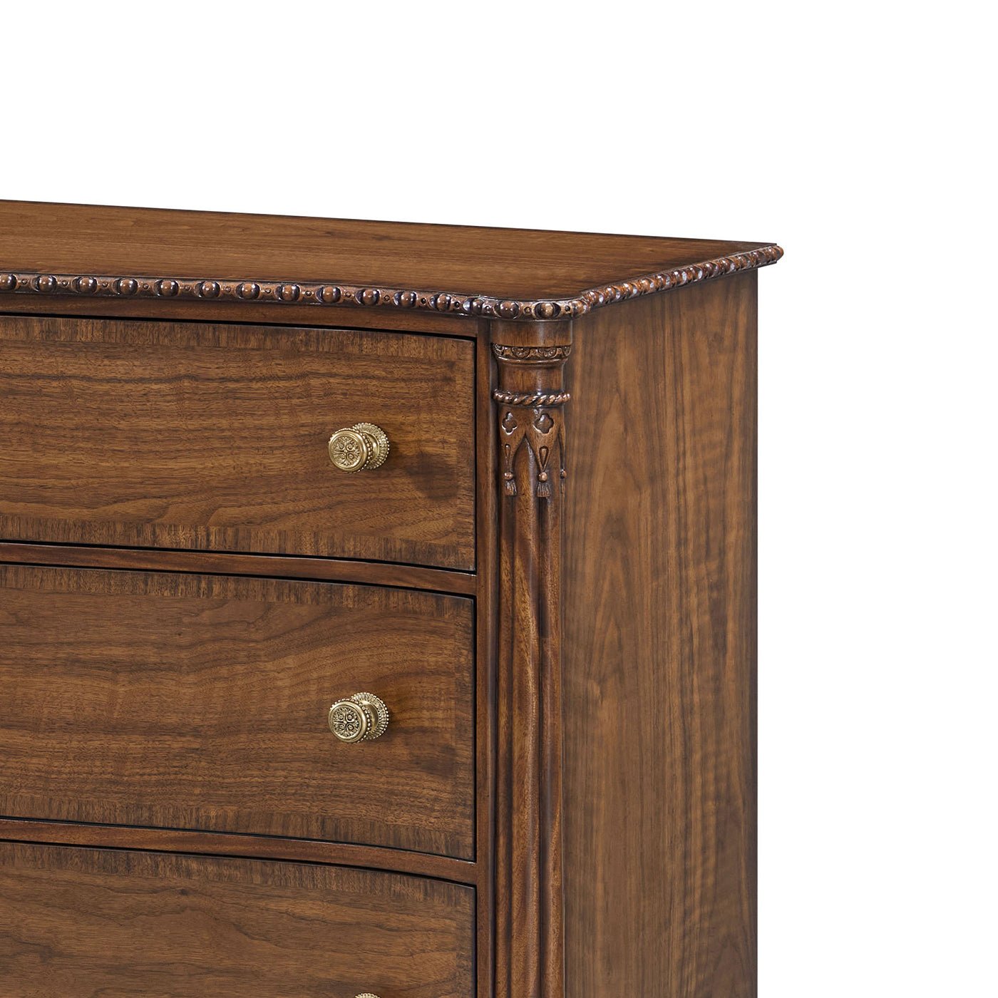 Detailed corner carving on English six drawer dresser.