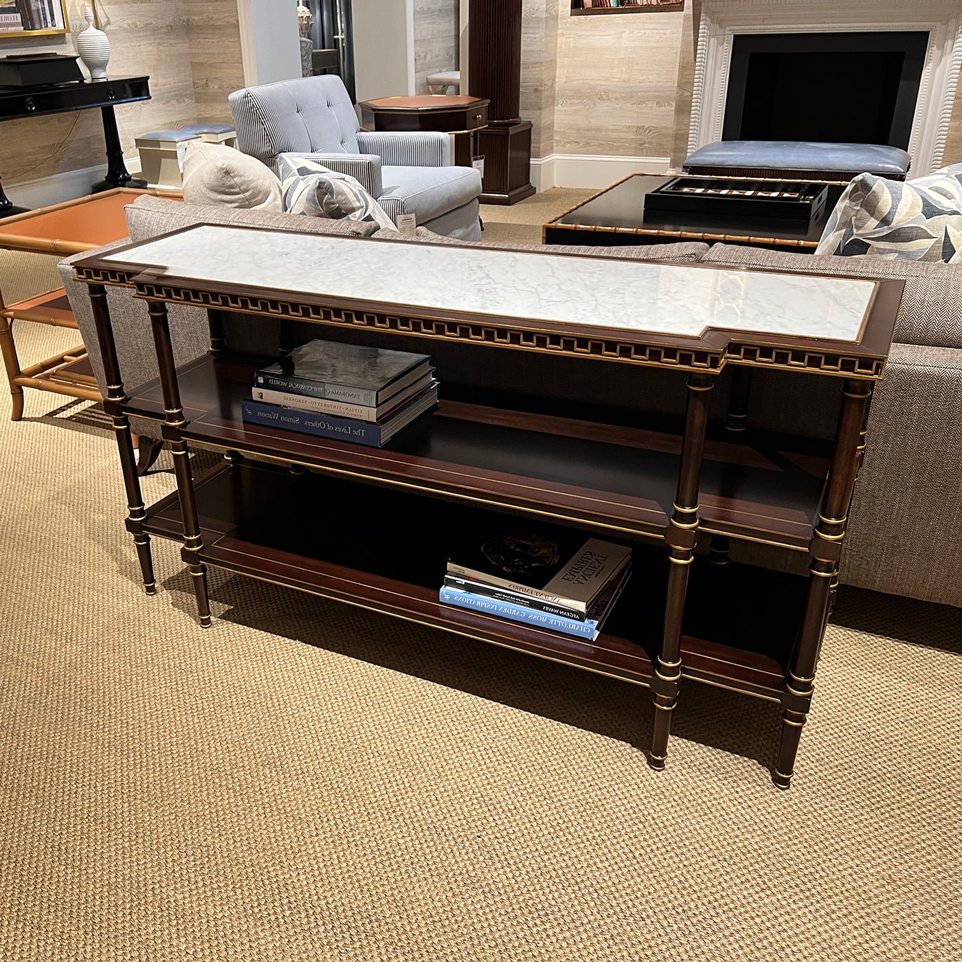 English console table with books, displayed in living room.