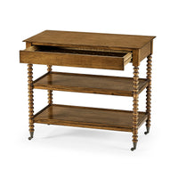 English three-tier end table with open drawer.