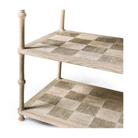 Second shelf detail of console table, patterns visible.