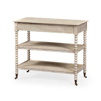 Angled view of whitewashed end table with three tiers.