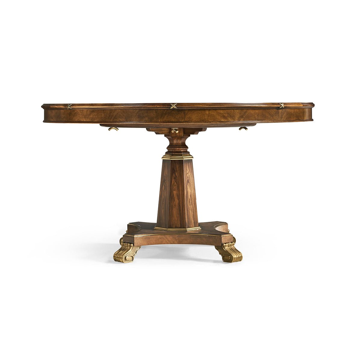 Round dining table with ornate base details.