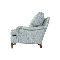 Blue paisley upholstered armchair, side profile.