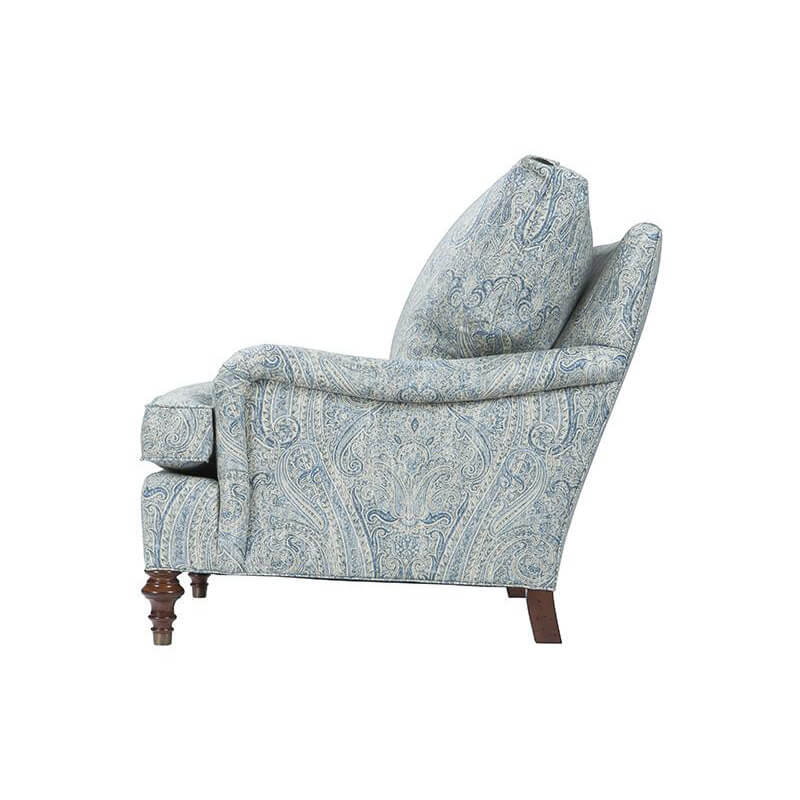 Blue paisley upholstered armchair, side profile.