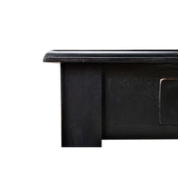 Black rustic desk close-up, corner and edge.