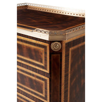 Side corner of neoclassic nightstand with brass accents.
