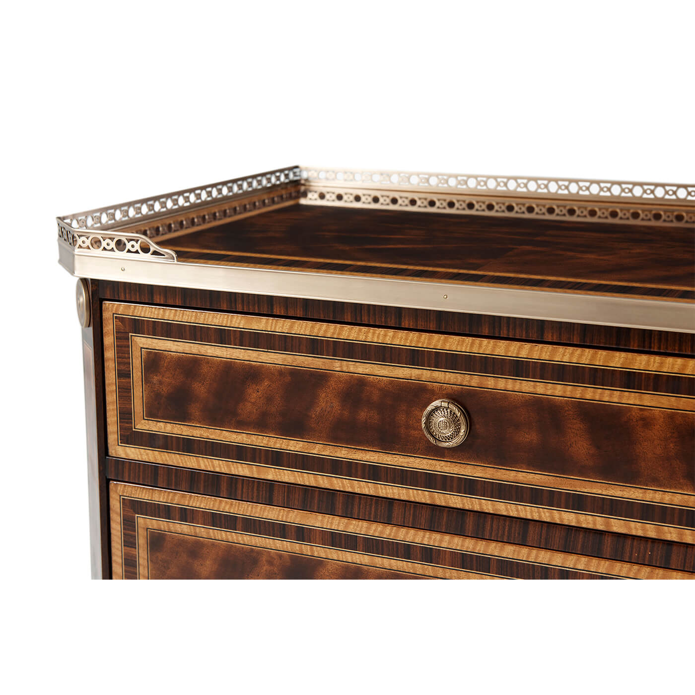 Close-up of nightstand's top with decorative brass border.