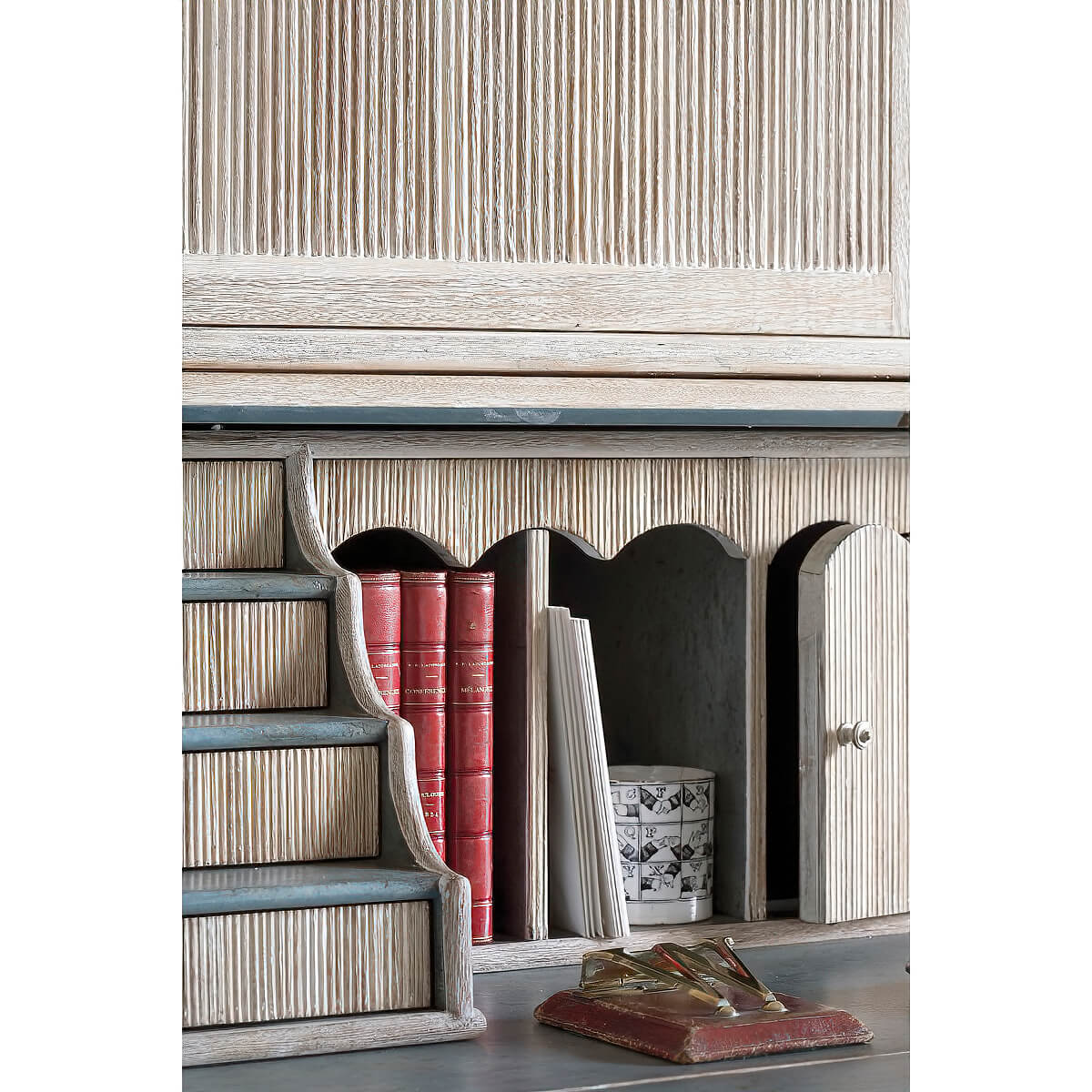 Interior compartments and books in secretary bookcase.