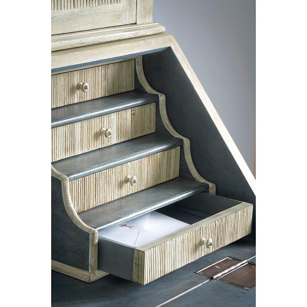 Drawer open with visible contents in bookcase desk.