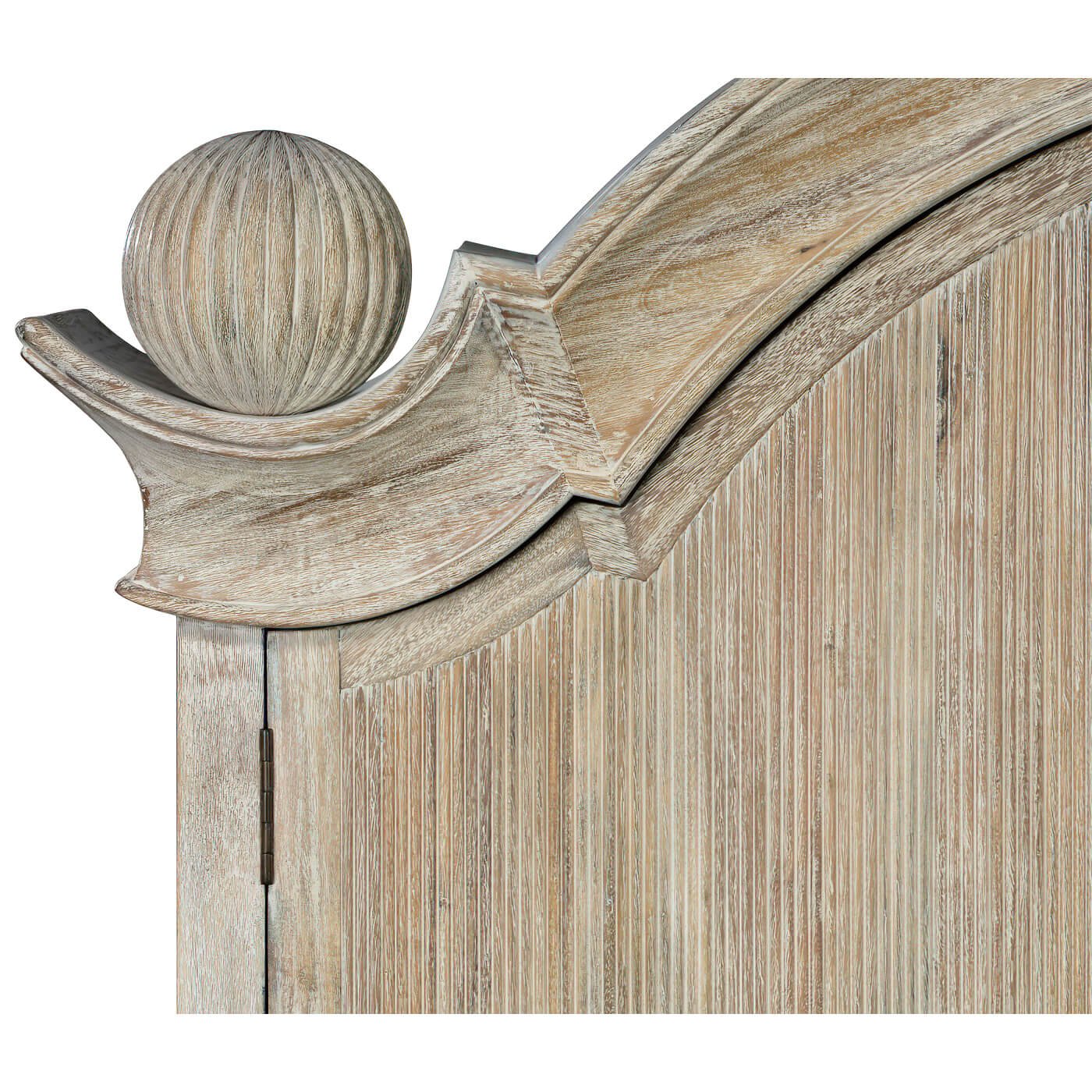 Close-up of ornate finial on bookcase top.
