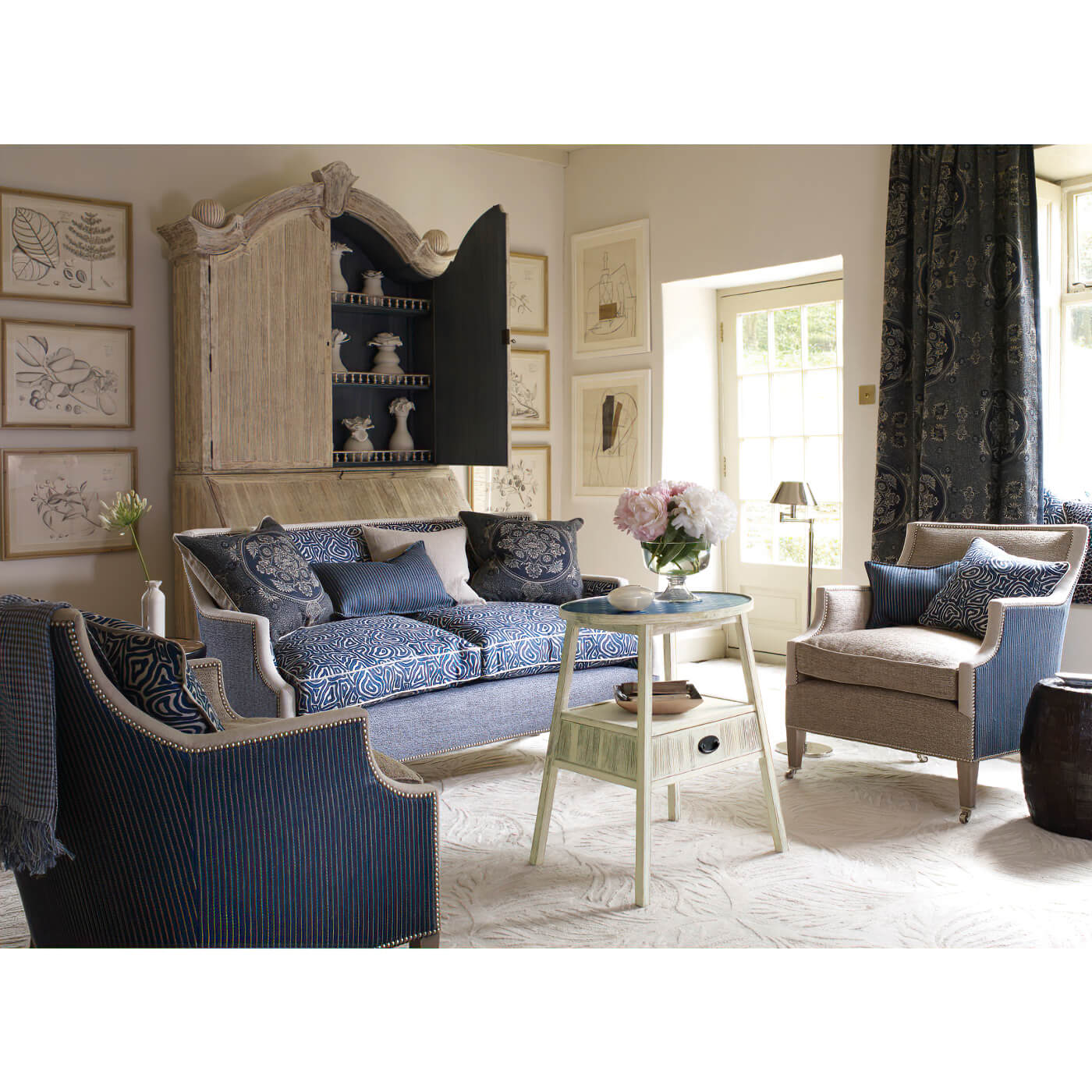Bookcase in elegant living room setting with decor.