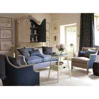 Bookcase in elegant living room setting with decor.
