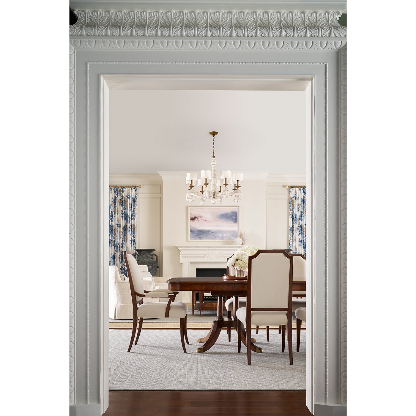 Dining room with extending English dining table, elegant setting.