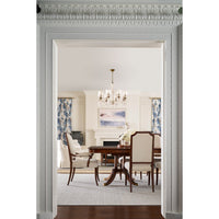 Dining room with extending English dining table, elegant setting.