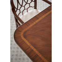 Close-up of table and chair, extending English dining table pattern.