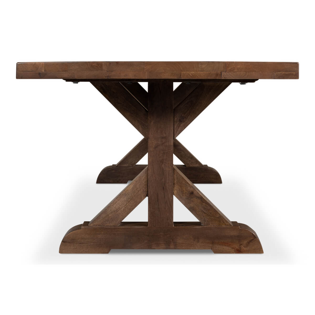 Side view of dining table with trestle base.
