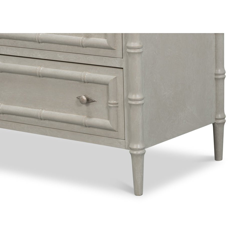 Bottom corner detail of faux bamboo chest legs.