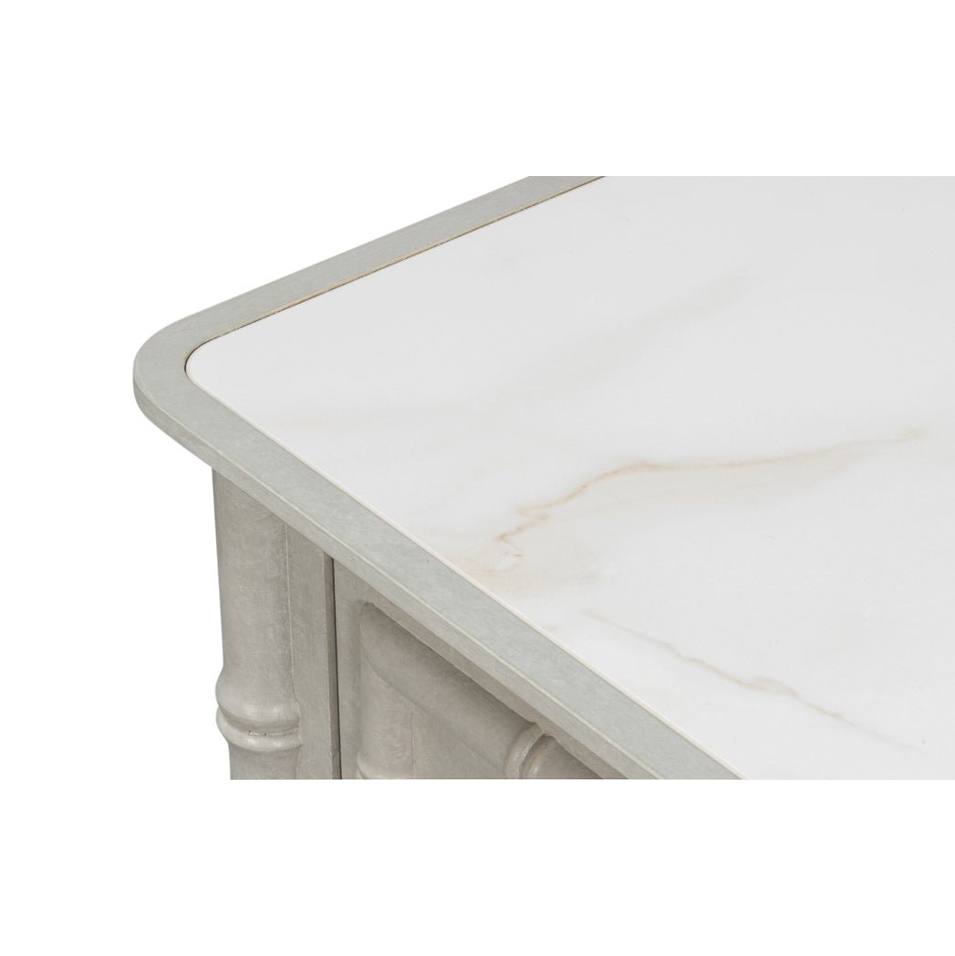 Close-up of faux bamboo chest top corner.