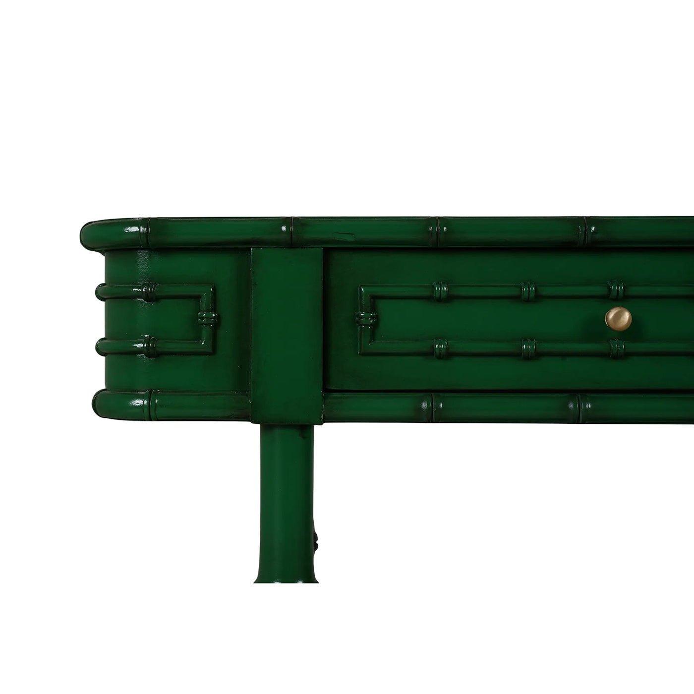Detailed view of faux bamboo console table corner.