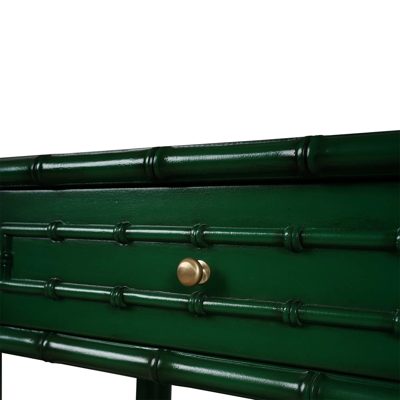 Close-up of faux bamboo console table drawer handle.