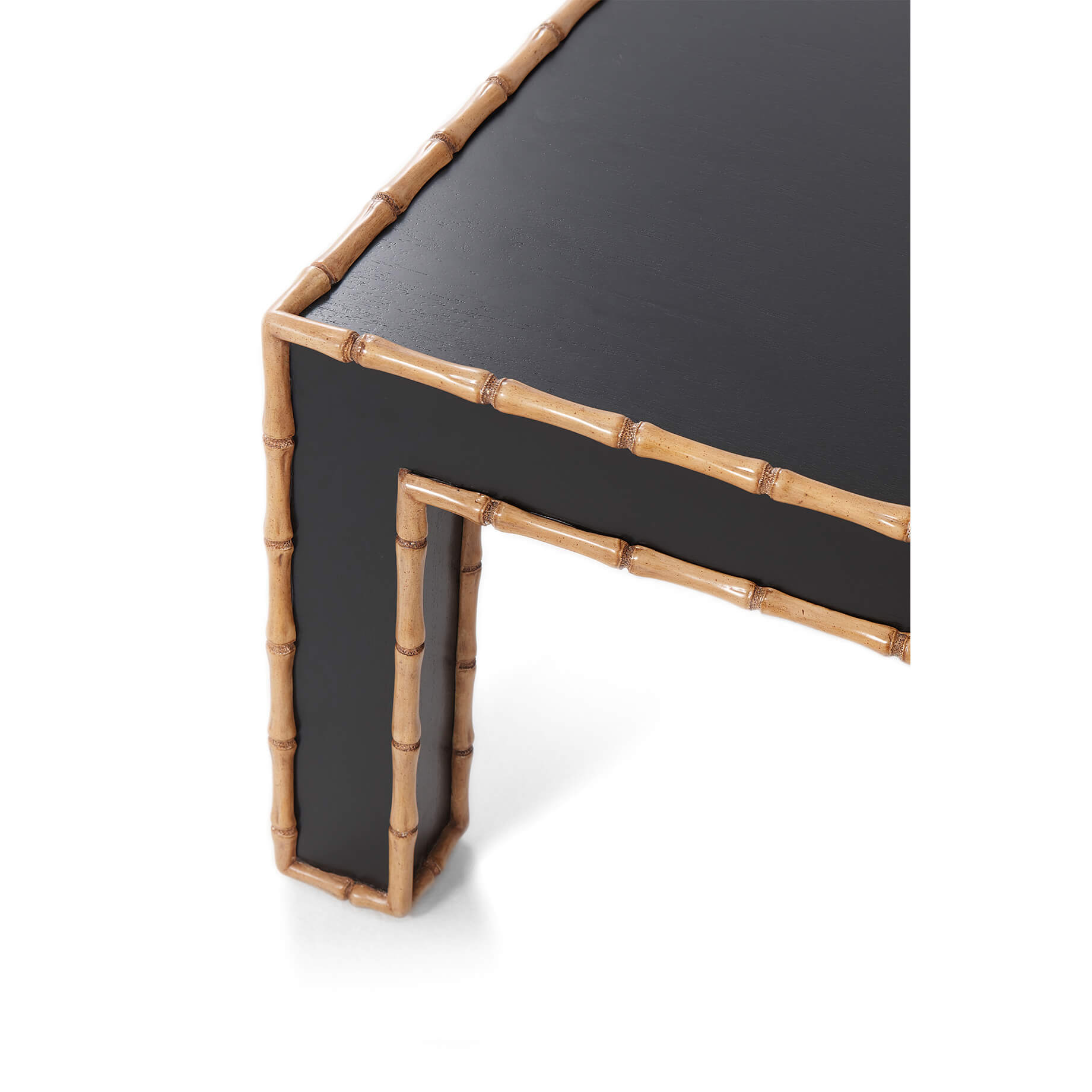Corner leg close-up of bamboo-trimmed coffee table, detailed.