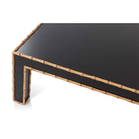 Close-up corner of faux bamboo cocktail table, detailed edges.