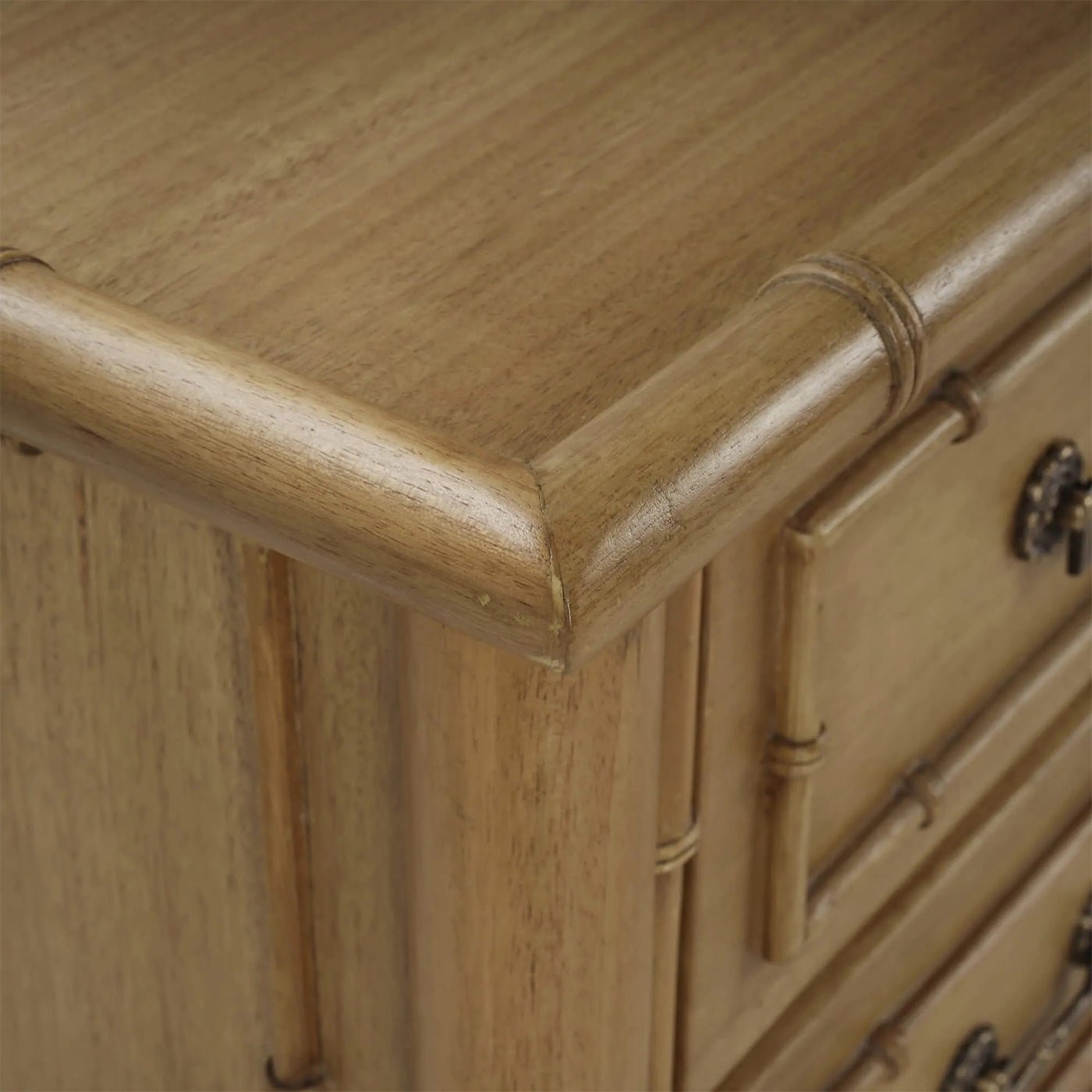 Detail of corner and drawer on faux bamboo chest