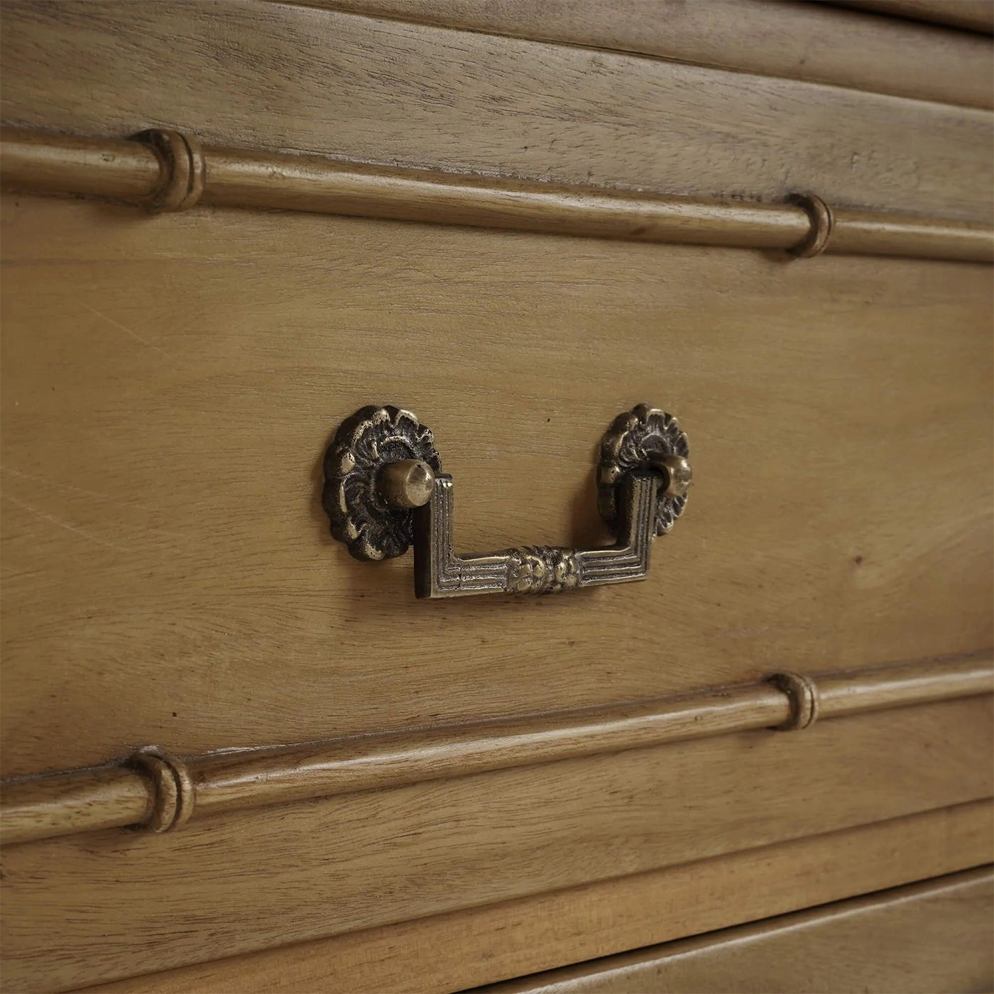 Faux bamboo chest drawer handle close-up
