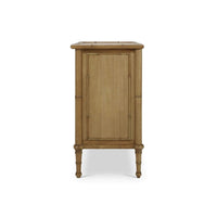 Side view of faux bamboo three drawer chest