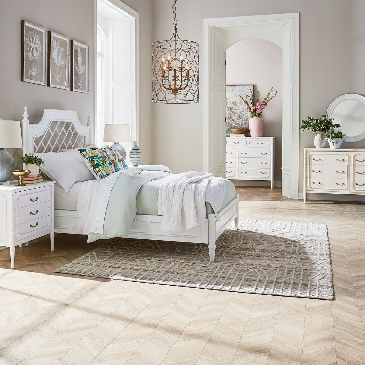 King bed in stylish bedroom setting with decor.
