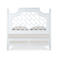 End view of king bed, showing lattice headboard.