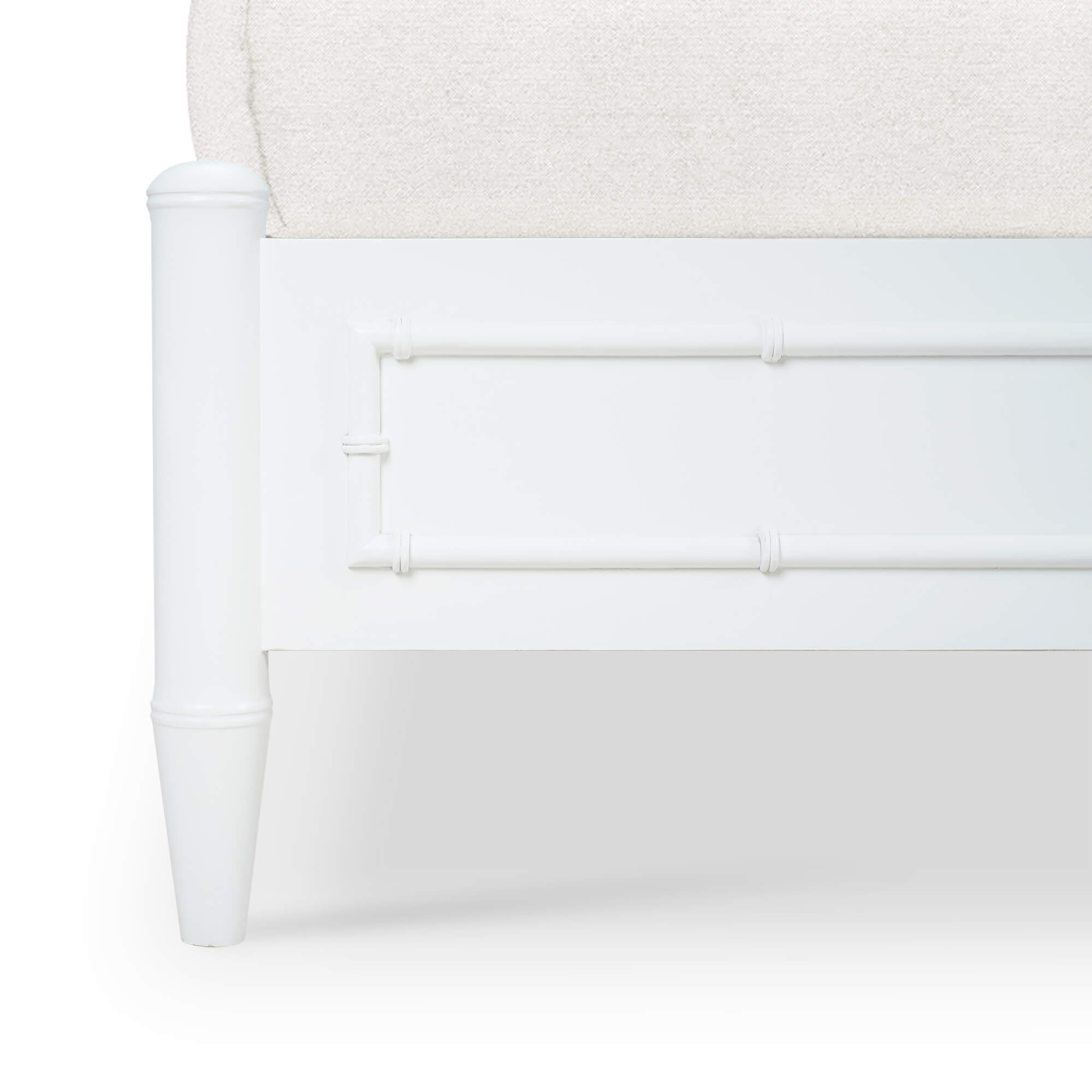 Close-up of bed's corner frame design.