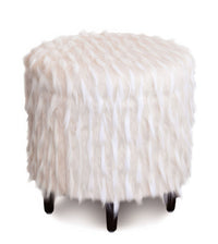 Round faux fur ottoman with a soft, textured surface.