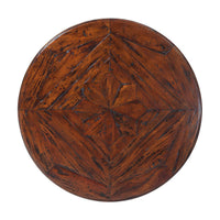Close-up of wooden tabletop with intricate geometric pattern.