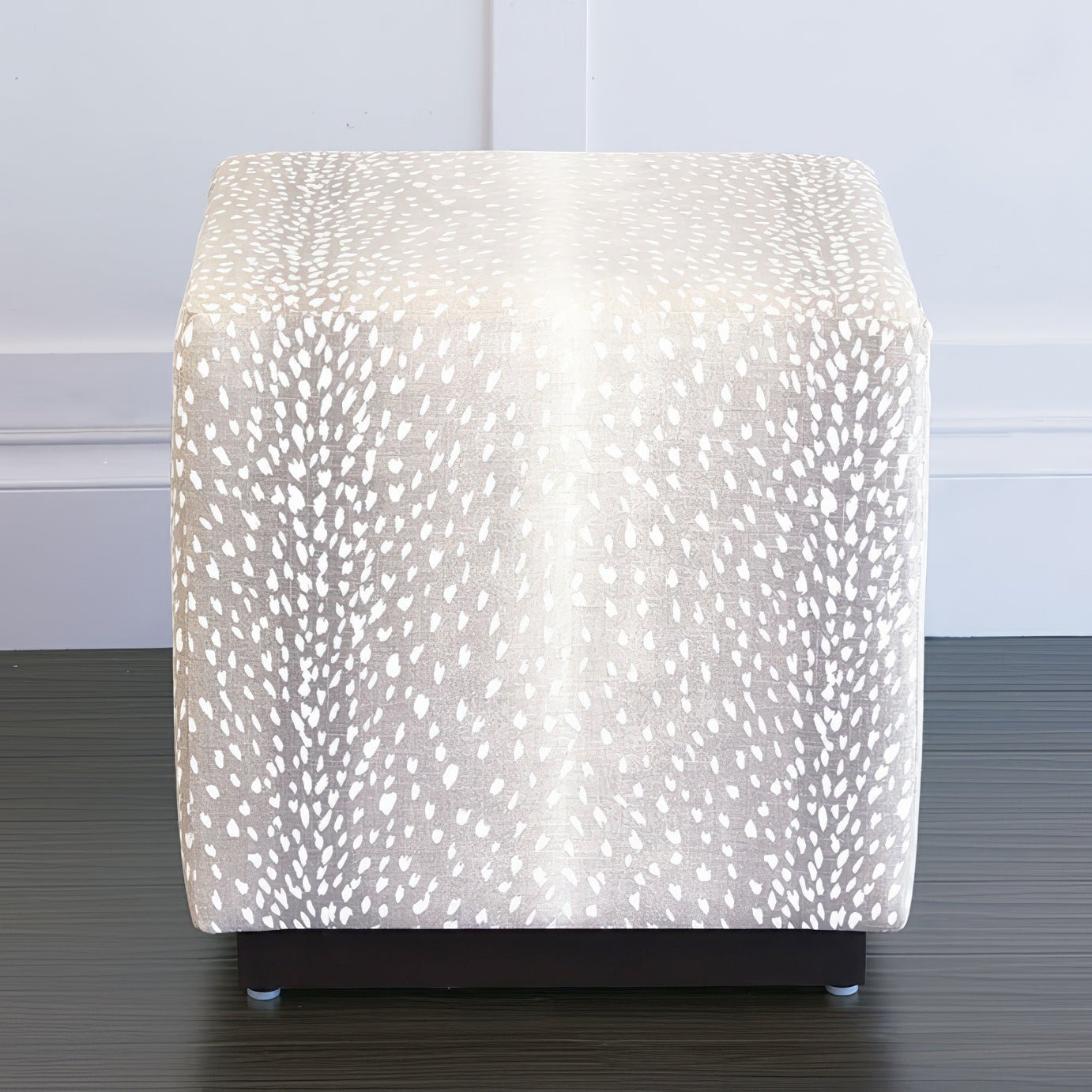 Fawn-patterned cube ottoman front view indoors.