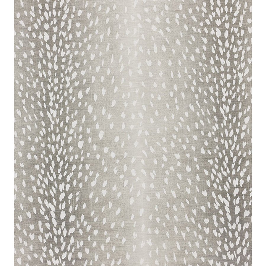 Close-up of fawn pattern fabric on grey ottoman.