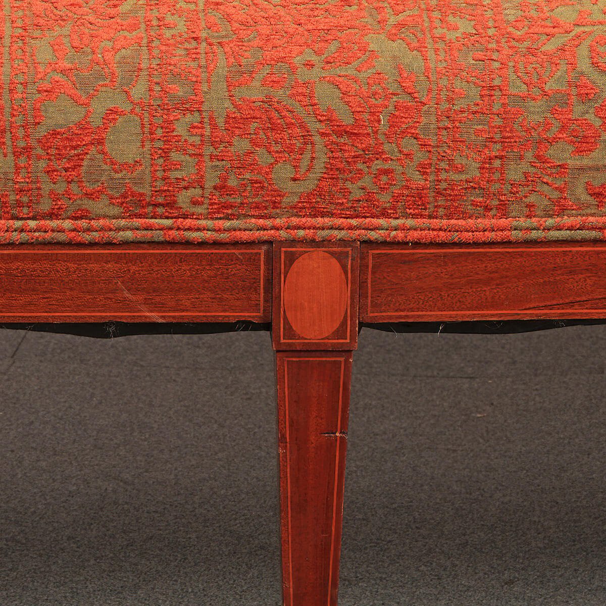 Close-up of Federal sofa leg and detailed inlay design.