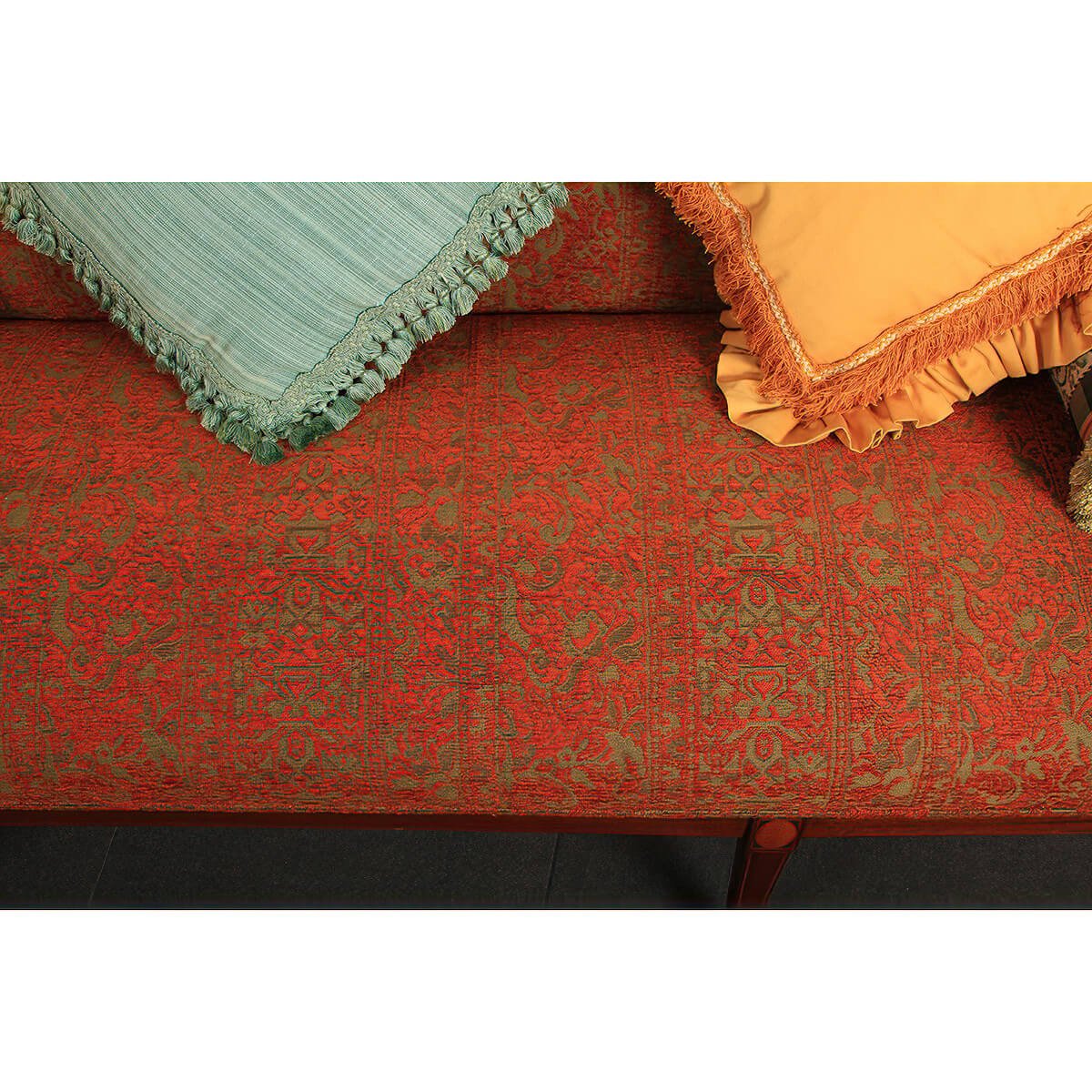 Federal sofa cushion texture with fringe pillows on top.