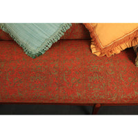 Federal sofa cushion texture with fringe pillows on top.