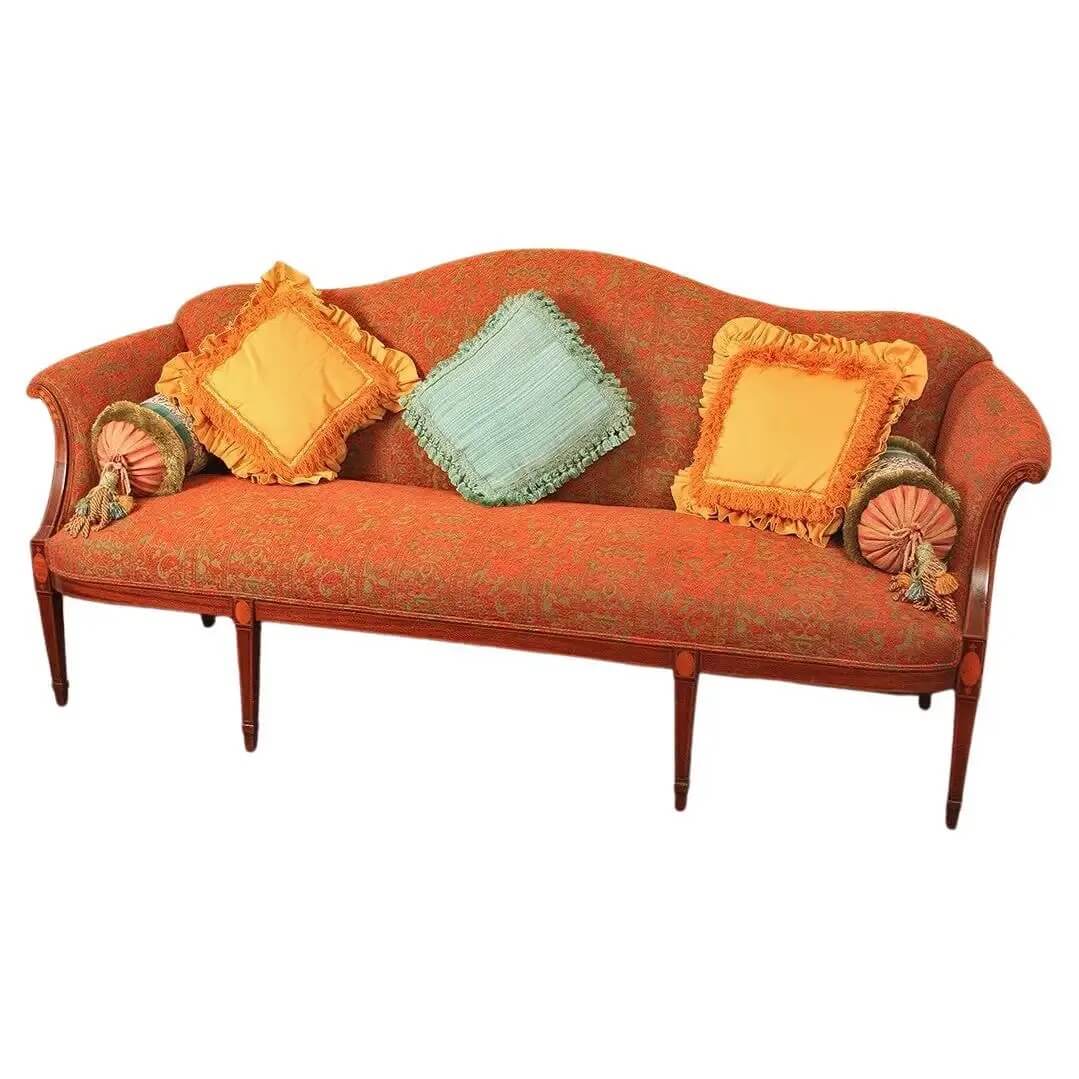 Federal mahogany inlaid sofa with colorful pillows, front view.