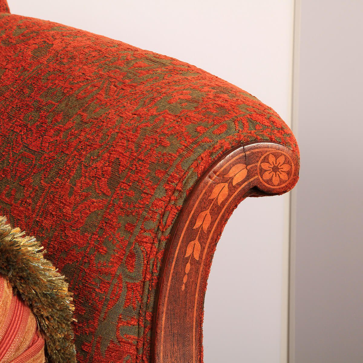 Armrest detail of Federal sofa with floral inlay pattern.