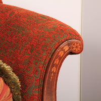 Armrest detail of Federal sofa with floral inlay pattern.