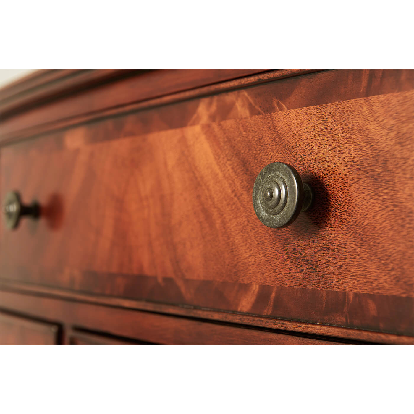 Close-up of drawer knob on federal mahogany chest.