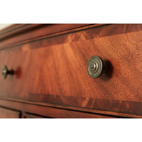 Close-up of drawer knob on federal mahogany chest.