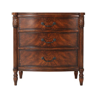 Front view of mahogany bedside chest with three drawers.