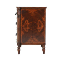 Side view showing intricate details of mahogany bedside chest.