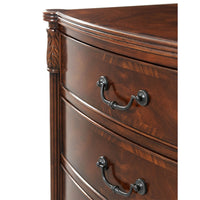 Close-up of drawer handles on mahogany bedside chest.