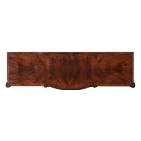 Top view of mahogany dresser showing wood grain.